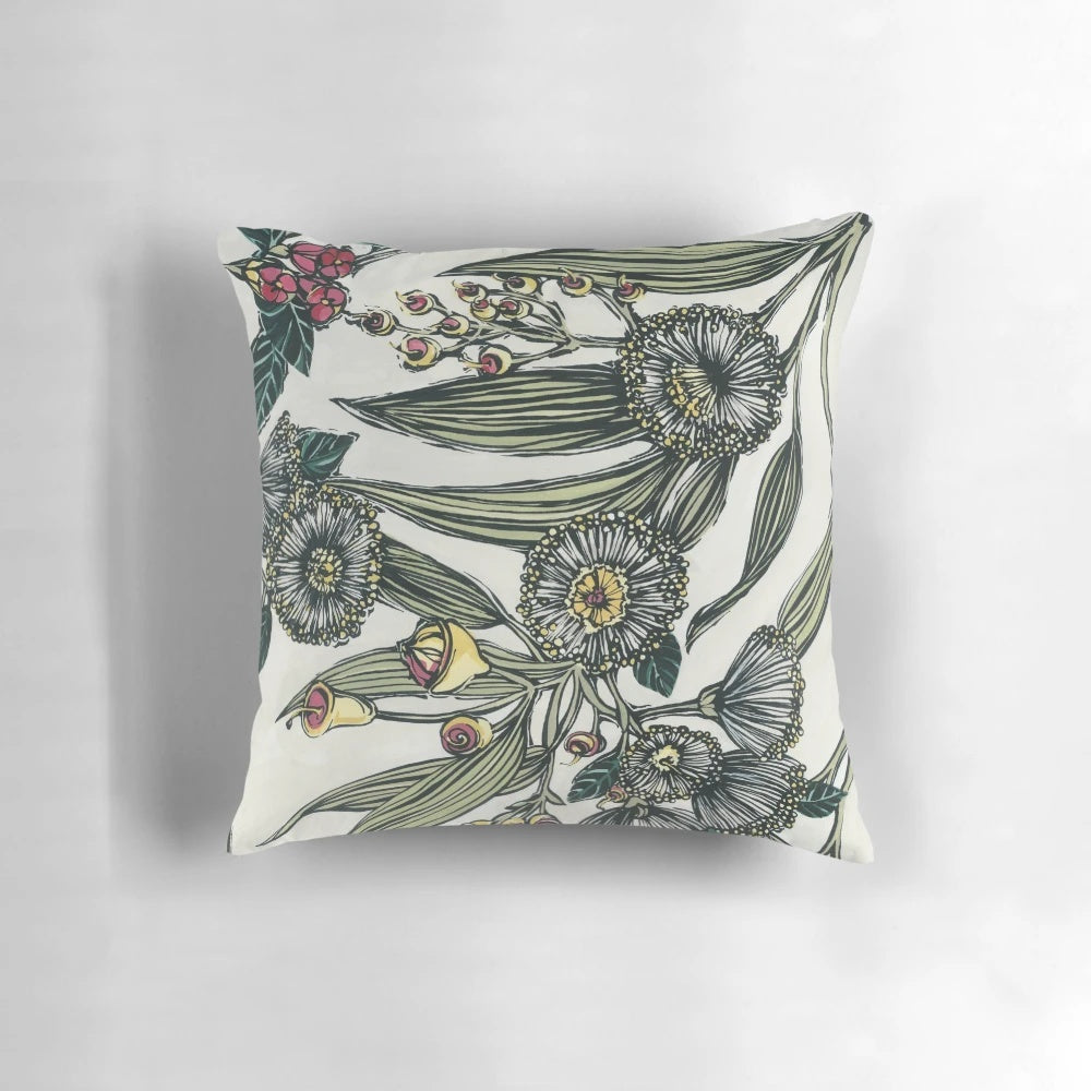 Retro-inspired floral pillow featuring hand-painted Australian native botanicals like gumleaves, gumnuts, and olive foliage.
