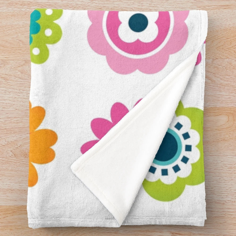 Colorful plush blanket with a vibrant retro floral pattern