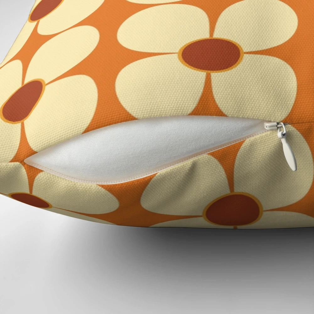 Vibrant orange and cream retro flower pattern throw pillow