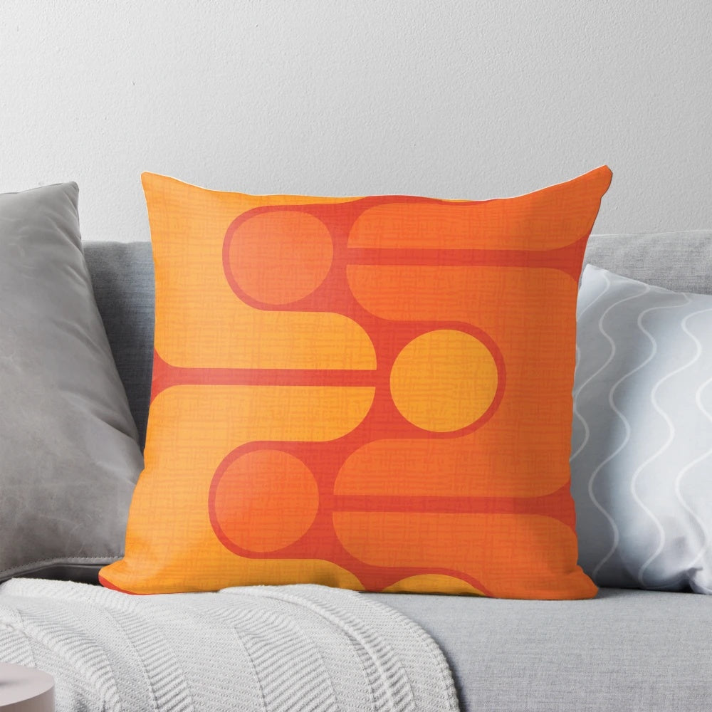 Vintage-inspired orange and yellow patterned pillow with a mid-century modern design