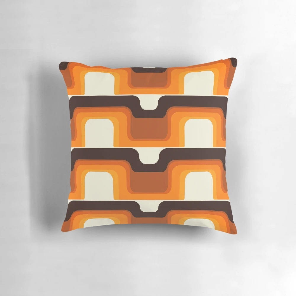 Vibrant orange and white mid-century modern inspired pillow with retro stripes and curves