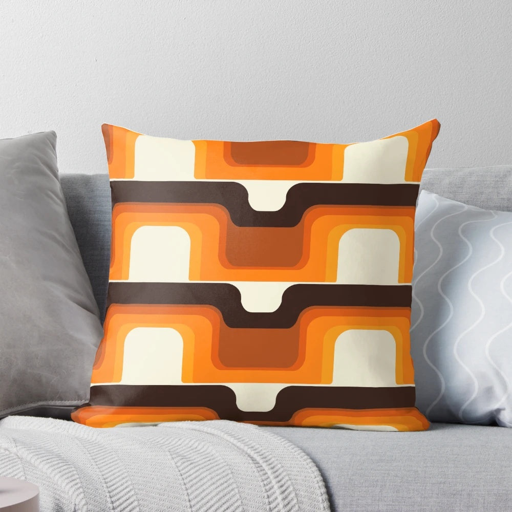 Vibrant orange and white mid-century modern inspired pillow with retro stripes and curves