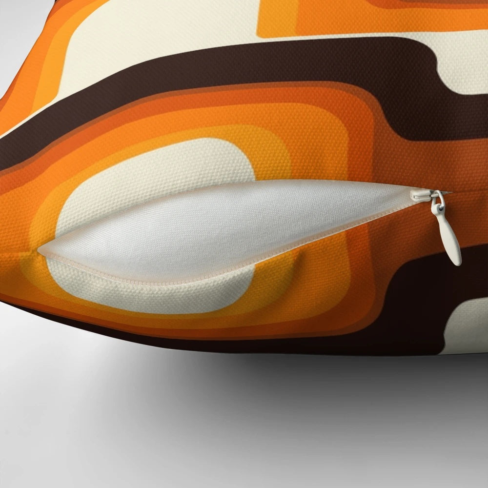 Vibrant orange and white mid-century modern inspired pillow with retro stripes and curves