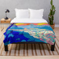 Vibrant pop art inspired plush blanket with a colorful river landscape design