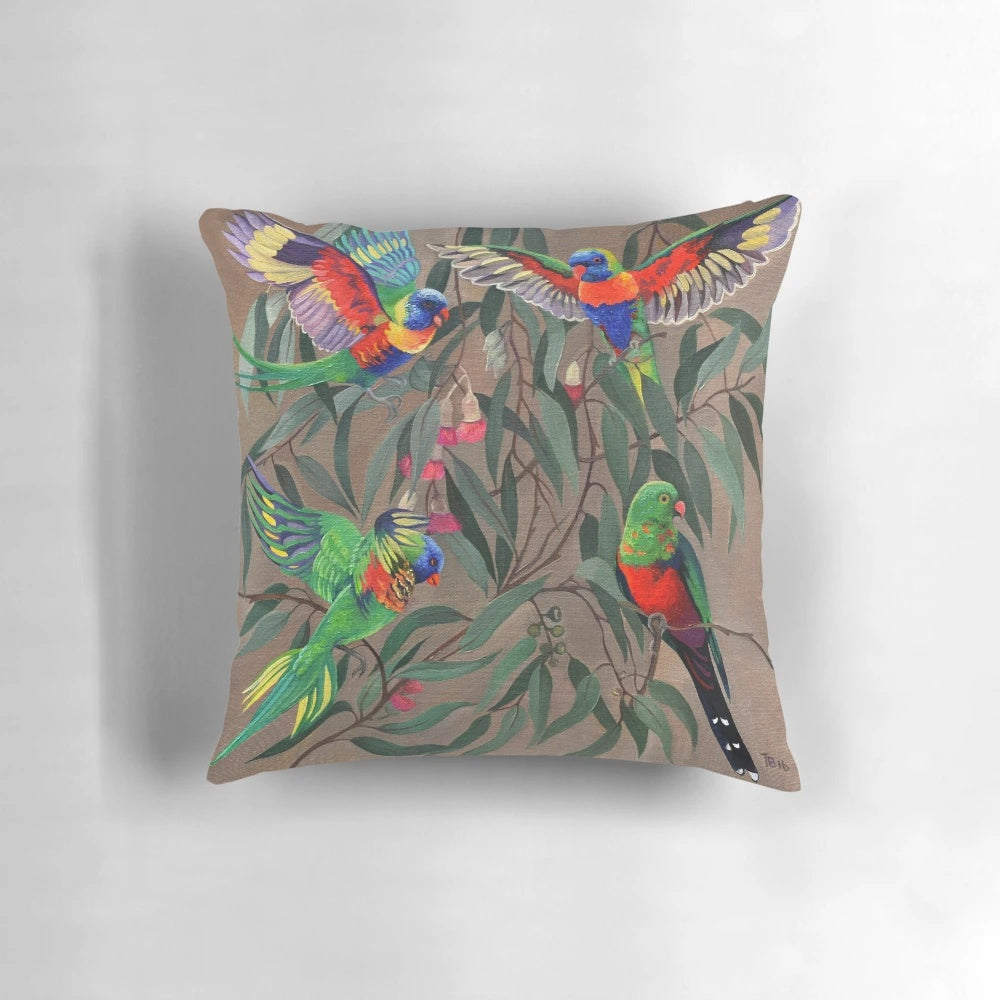 Colorful rosella parrots perched on a branch, featured on a decorative throw pillow.
