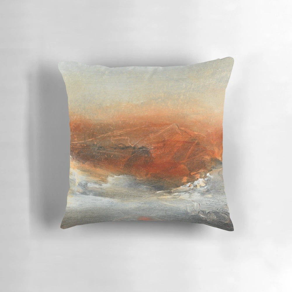 Rust-inspired abstract landscape painting on a large decorative pillow.