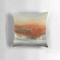 Rust-inspired abstract landscape painting on a large decorative pillow.