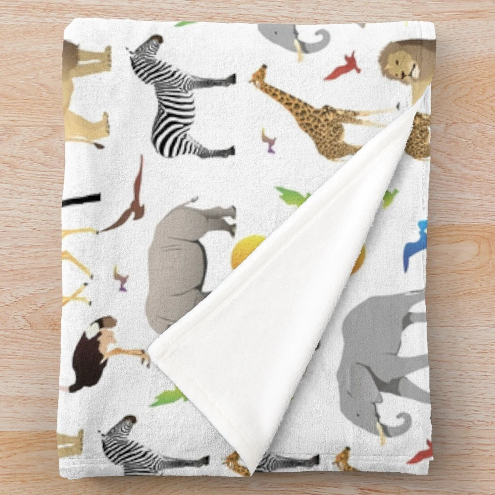 Colorful plush blanket with various African safari animals like elephants, zebras, and giraffes