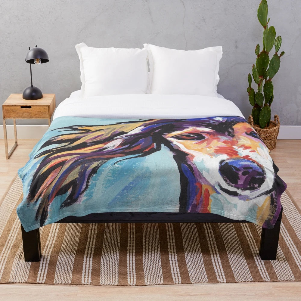Colorful pop art portrait of a Saluki hound dog on a plush blanket