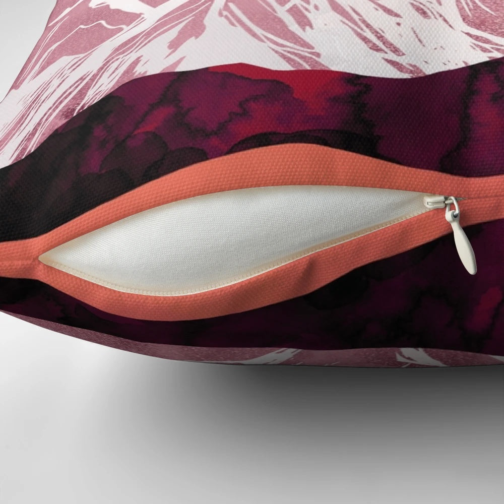 Scarlet, pink, and purple watercolor painting of a mountain landscape on a decorative throw pillow