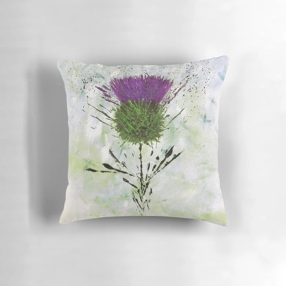 A contemporary style pillow featuring a beautiful Scottish thistle design in shades of purple and green.