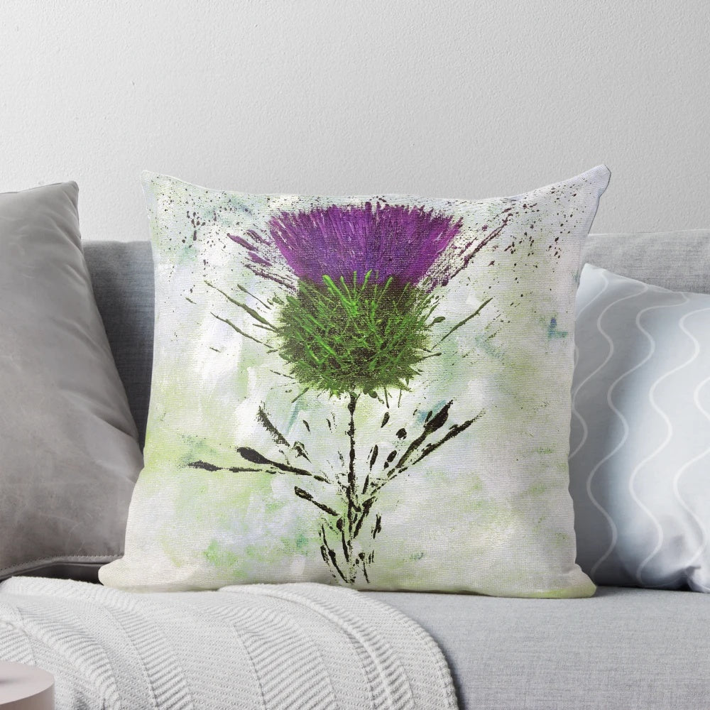 A contemporary style pillow featuring a beautiful Scottish thistle design in shades of purple and green.