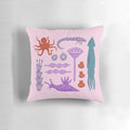 Colorful pillow featuring an artistic design of various sea creatures like octopus, squid, and seaweed