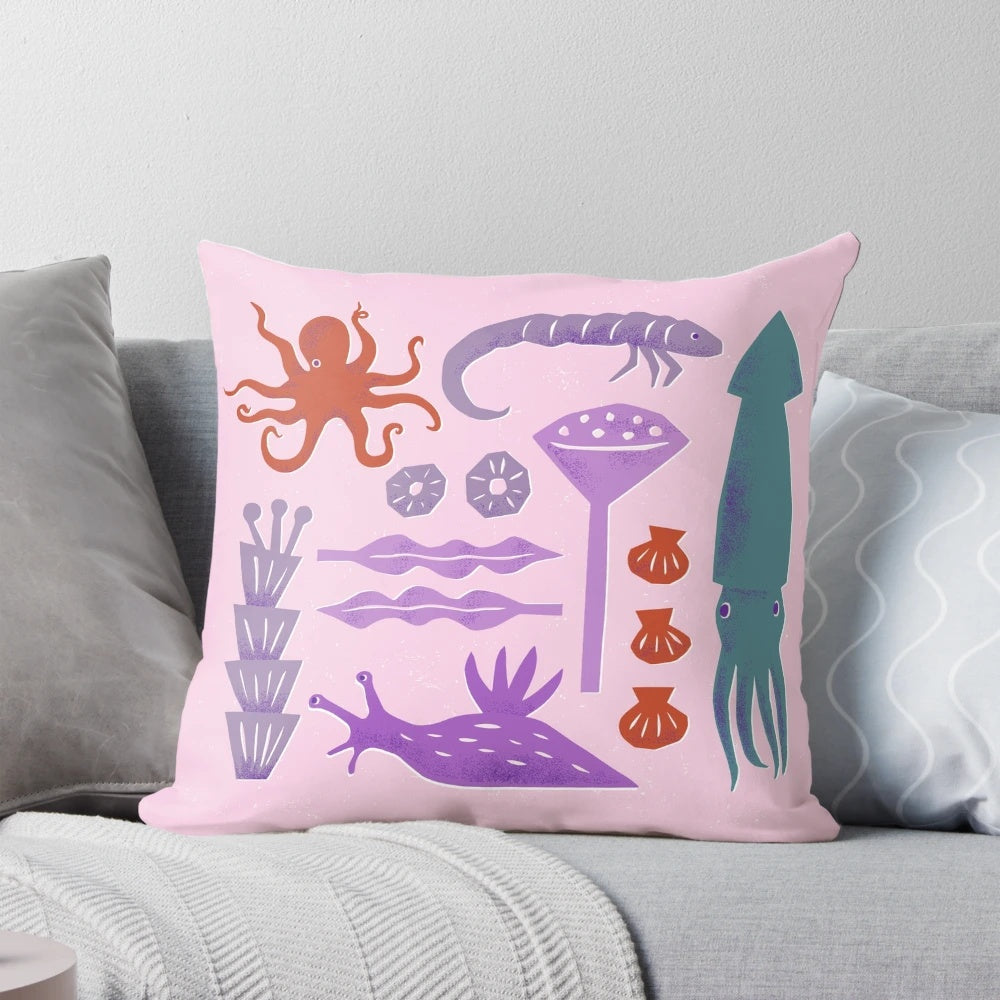 Colorful pillow featuring an artistic design of various sea creatures like octopus, squid, and seaweed