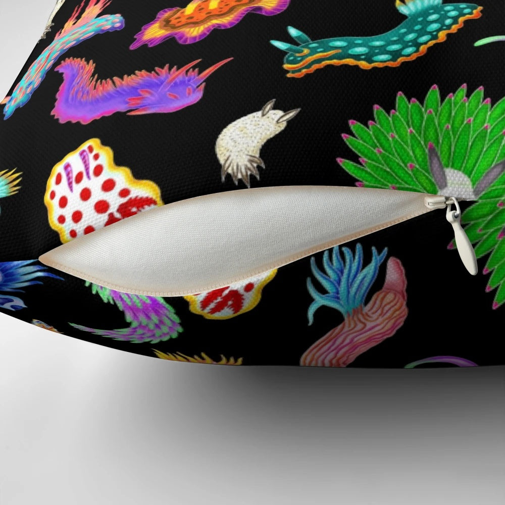 Colorful rainbow nudibranchs (sea slugs) printed on a throw pillow for vibrant marine-themed home decor.