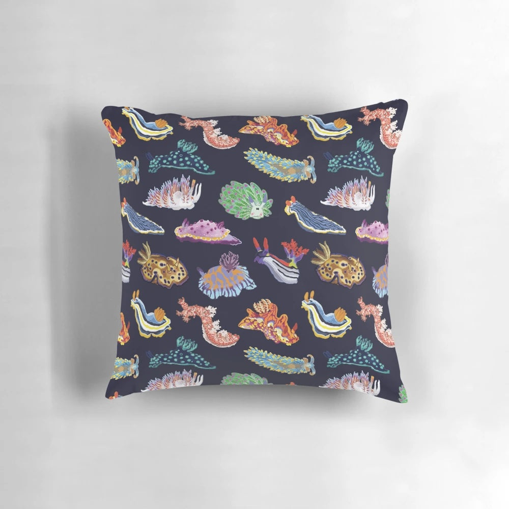 Vibrant and colorful pillow design featuring a detailed illustration of a sea slug or nudibranch, a marine gastropod mollusk.