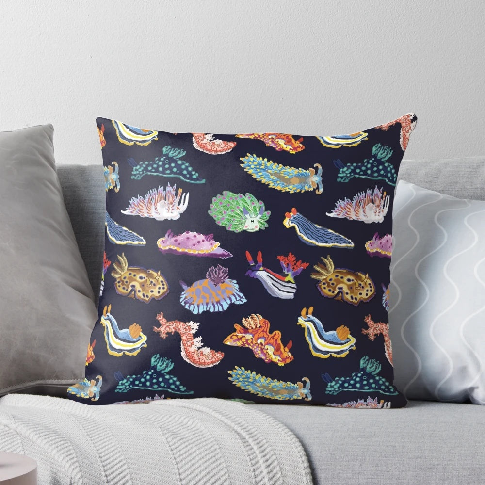 Vibrant and colorful pillow design featuring a detailed illustration of a sea slug or nudibranch, a marine gastropod mollusk.