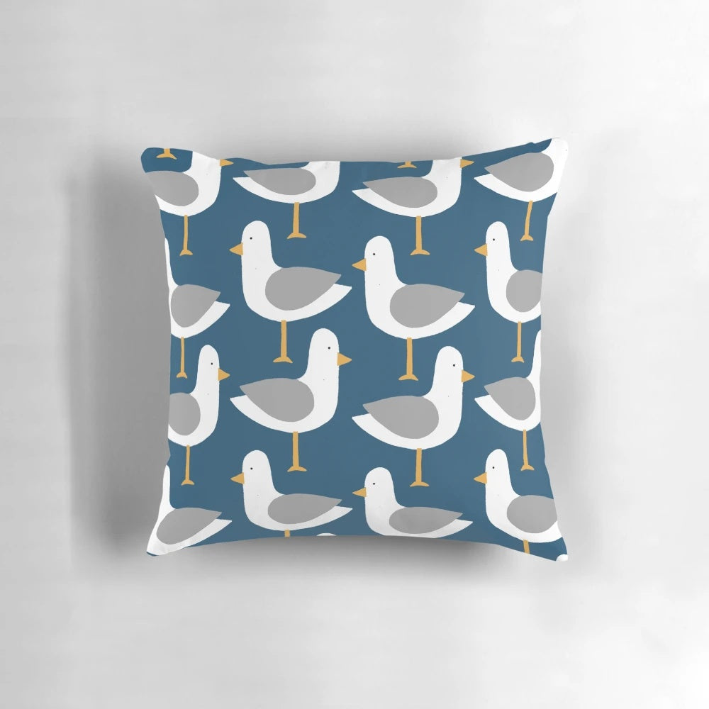 Colorful seagull pattern decorative pillow in shades of blue, green, pink, and orange