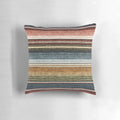 Decorative serape stripe pattern pillow in rust orange and blue colors
