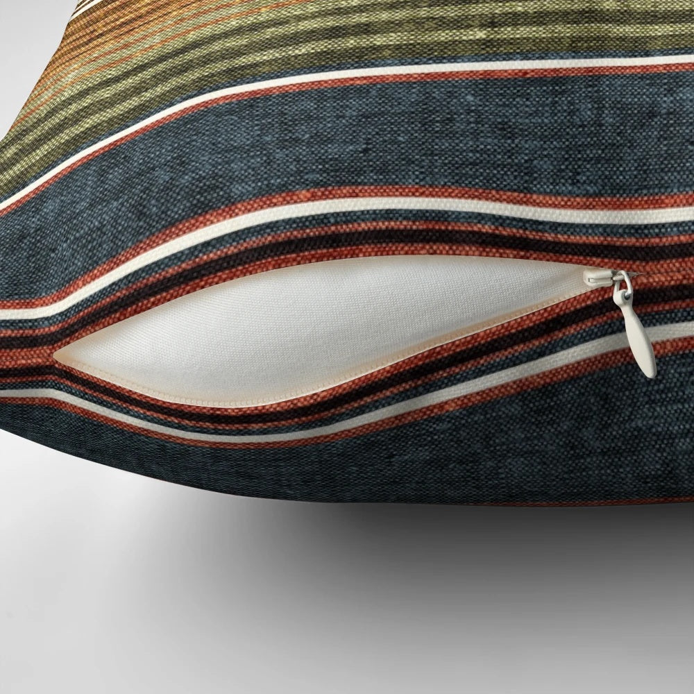 Decorative serape stripe pattern pillow in rust orange and blue colors