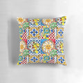 Colorful mosaic pillow with Sicilian tile pattern, lemons, and baroque leaf design