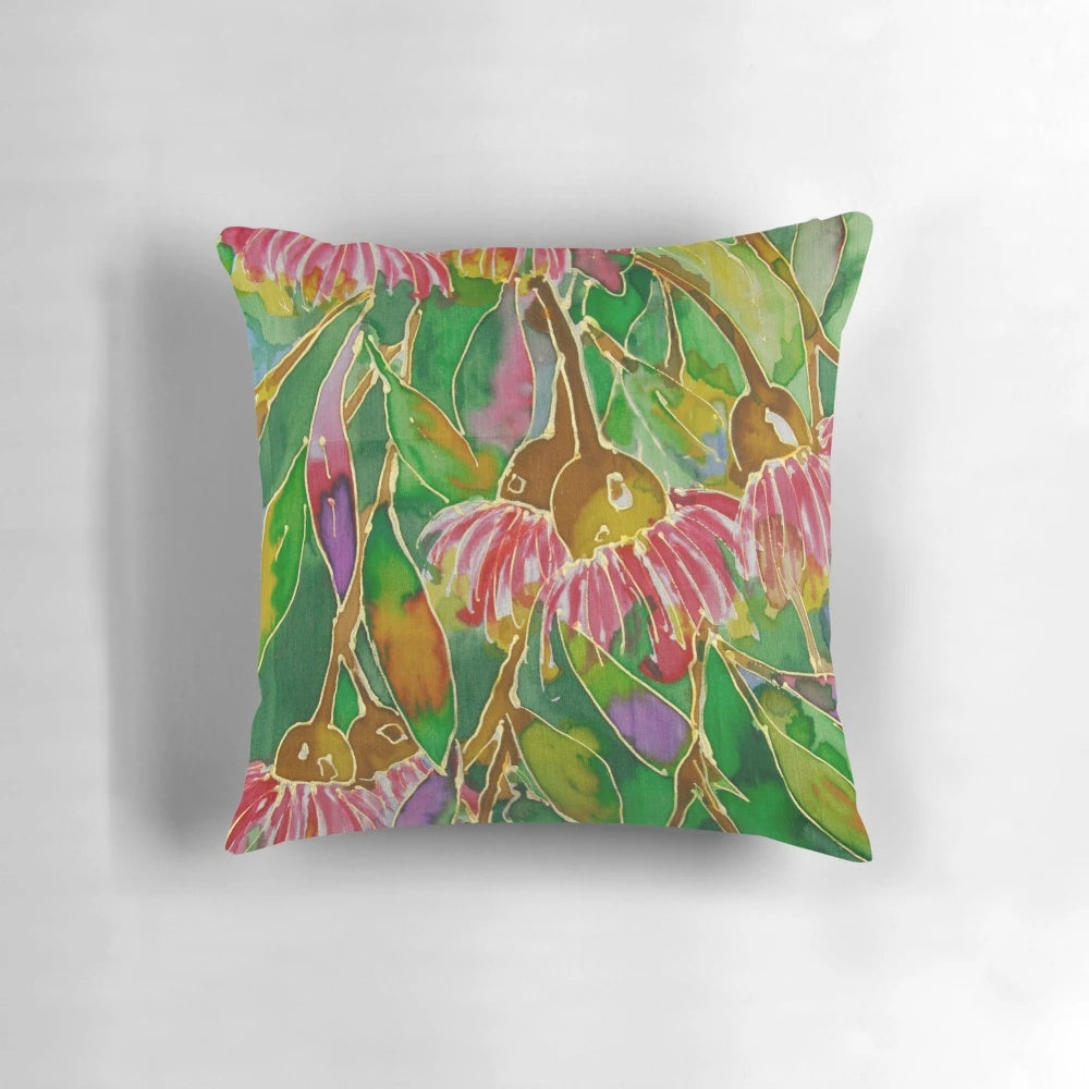 Vibrant silk painting of lush green leaves on a decorative pillow