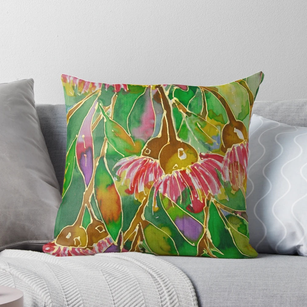 Vibrant silk painting of lush green leaves on a decorative pillow