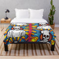 Colorful plush blanket featuring a skull chef design for kitchen decor
