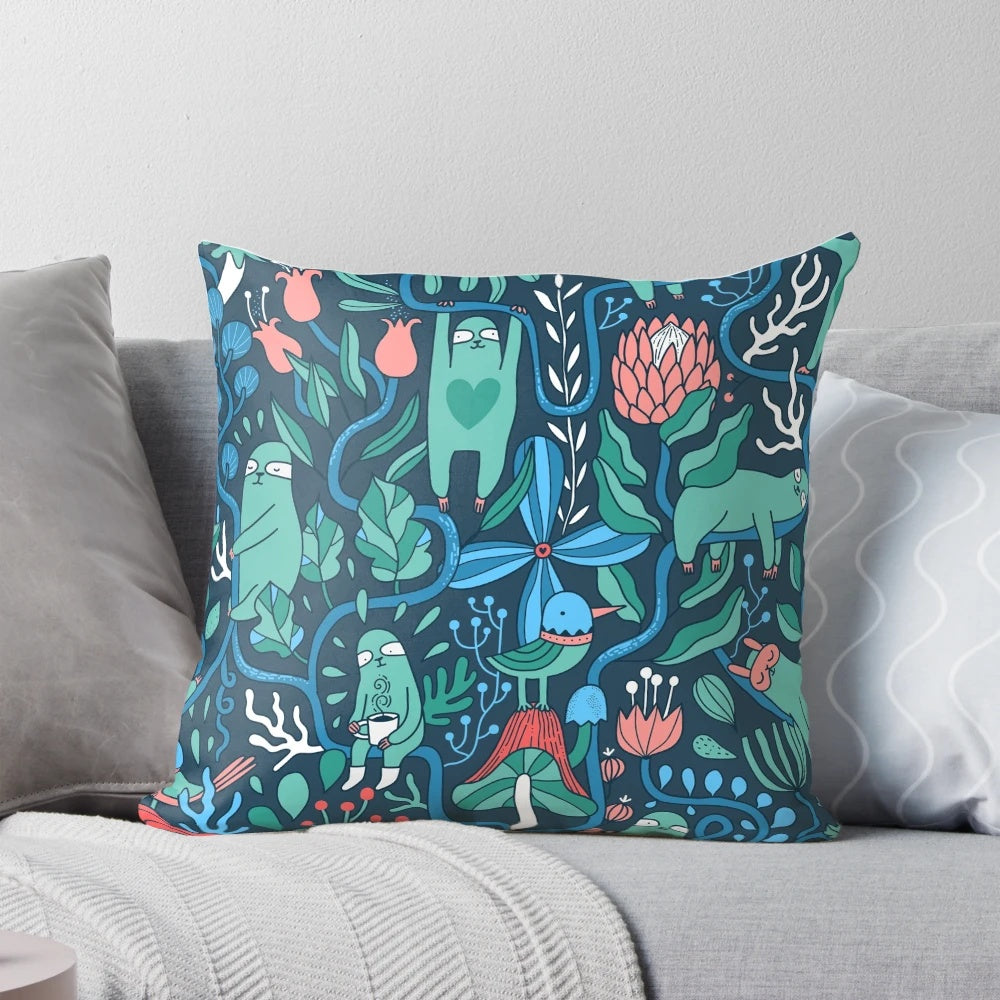 Colorful sloth-themed pillow with a lush, nature-inspired floral pattern