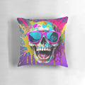 A vibrant pillow featuring a smiling skull wearing sunglasses with a colorful splatter effect, perfect for adding a touch of creativity to any space.