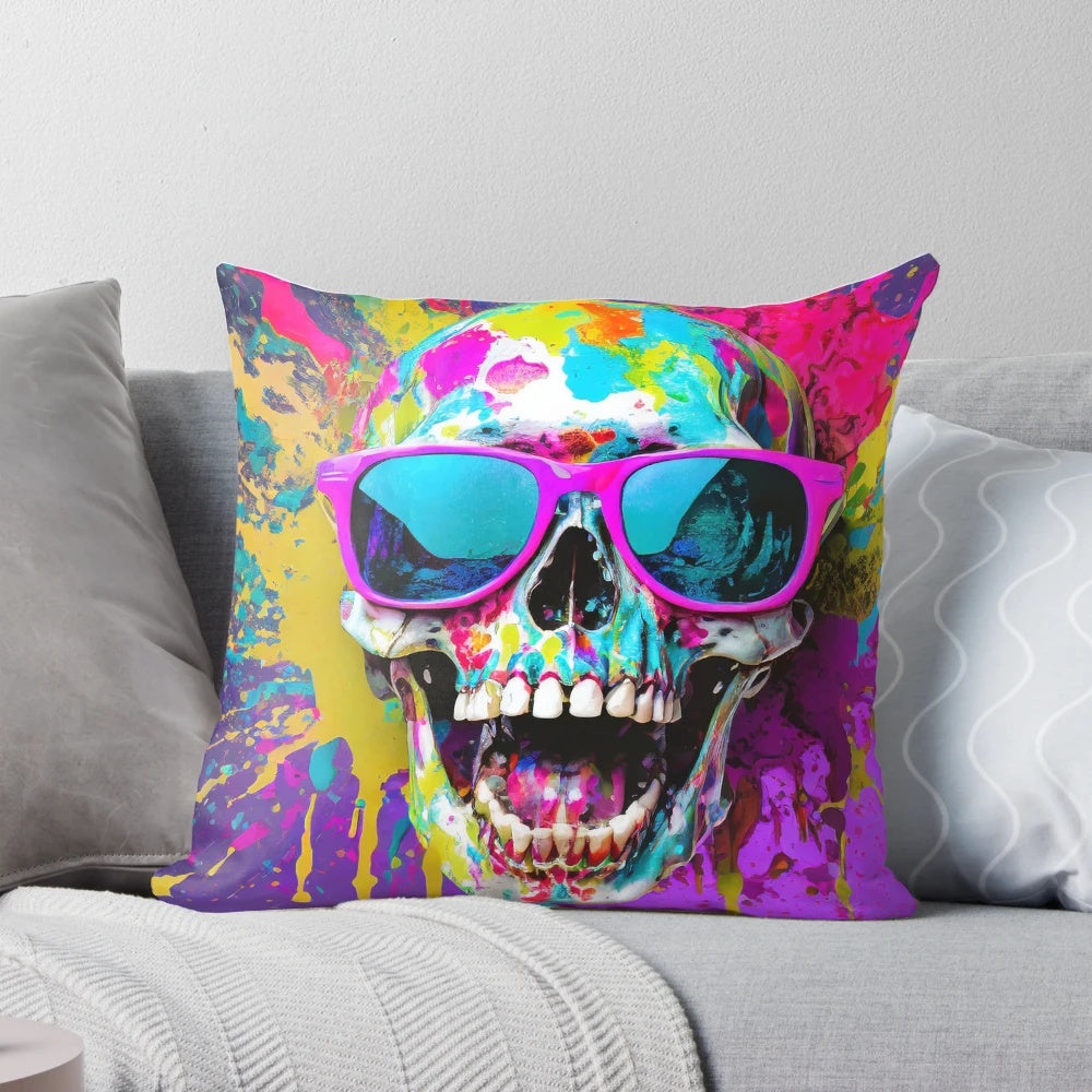 A vibrant pillow featuring a smiling skull wearing sunglasses with a colorful splatter effect, perfect for adding a touch of creativity to any space.