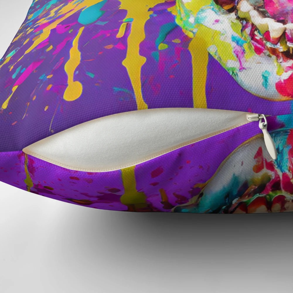 A vibrant pillow featuring a smiling skull wearing sunglasses with a colorful splatter effect, perfect for adding a touch of creativity to any space.