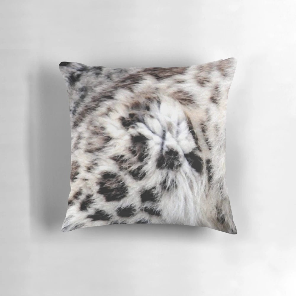Colorful abstract design featuring a snow leopard print on a decorative throw pillow