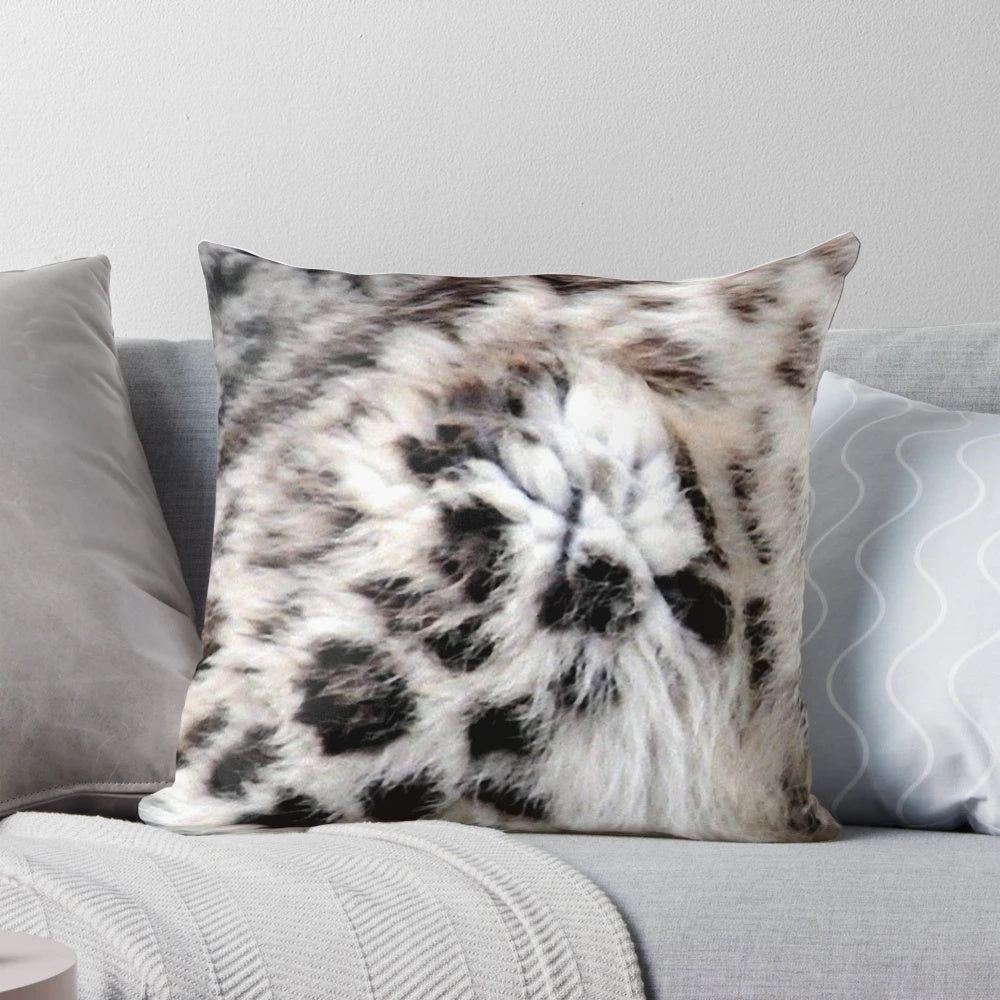 Colorful abstract design featuring a snow leopard print on a decorative throw pillow