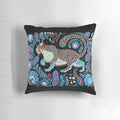 Vibrant hand-painted snow leopard folk art design on a decorative pillow