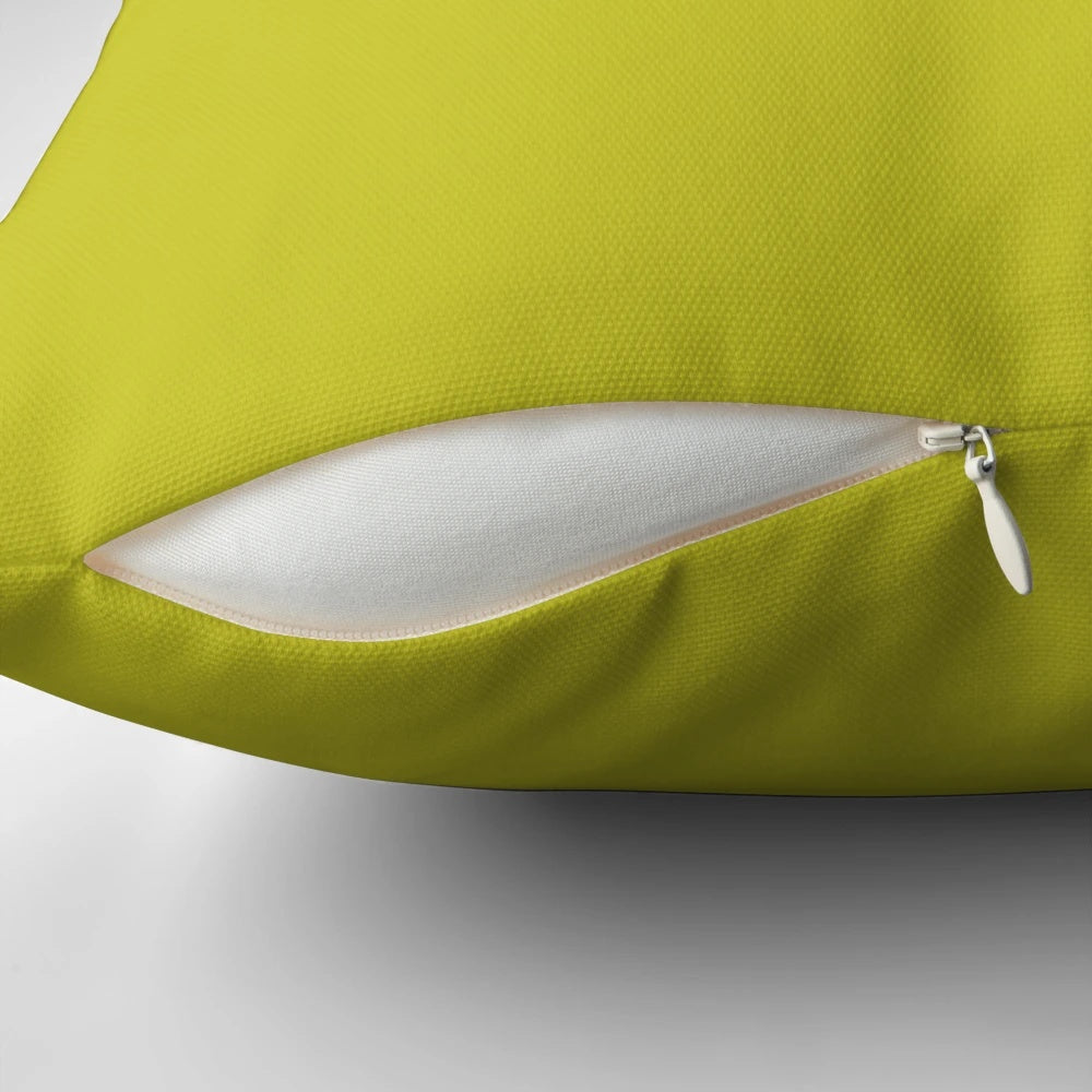 Solid chartreuse green pillow, a vibrant and classic home decor accent.
