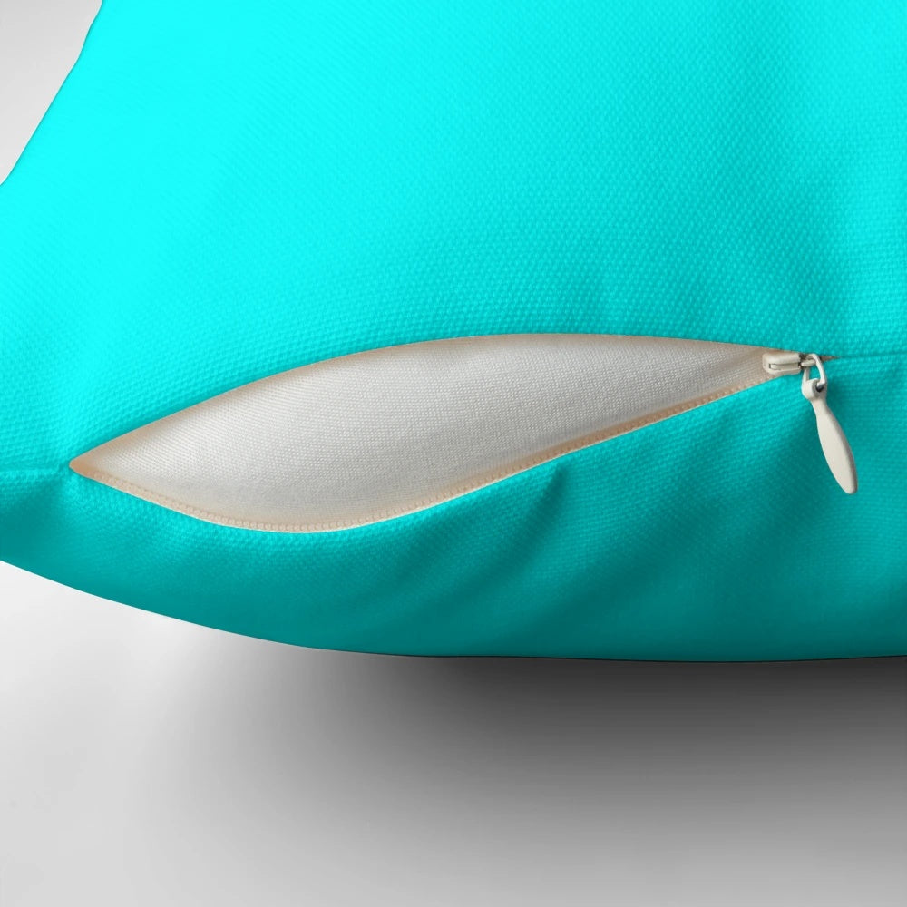 Solid cyan decorative pillow with turquoise and aqua accents, offering a modern and vibrant design for home decor.