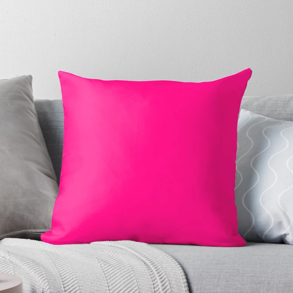 Bright pink decorative pillow with various shades of pink