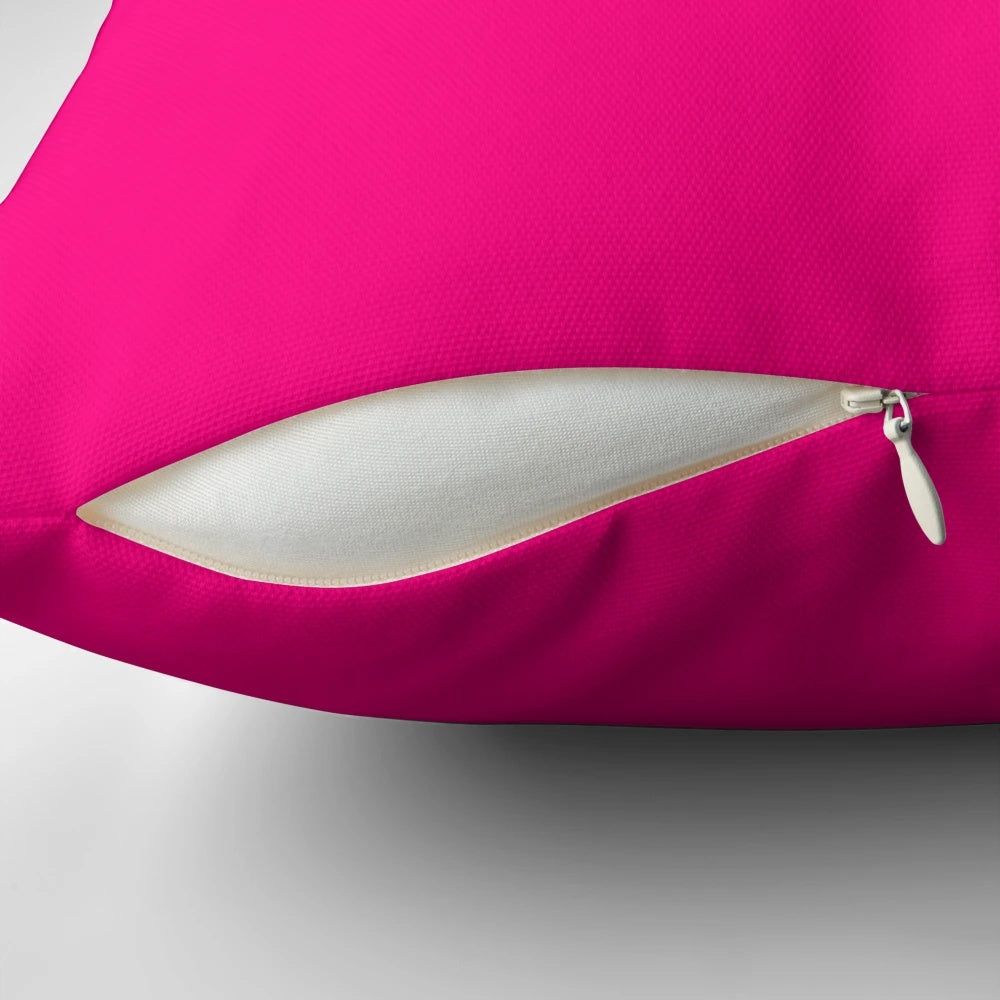 Bright pink decorative pillow with various shades of pink
