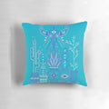 A vibrant blue and purple pillow featuring a southwestern-inspired cactus and succulent pattern, perfect for adding a touch of desert style to your home.