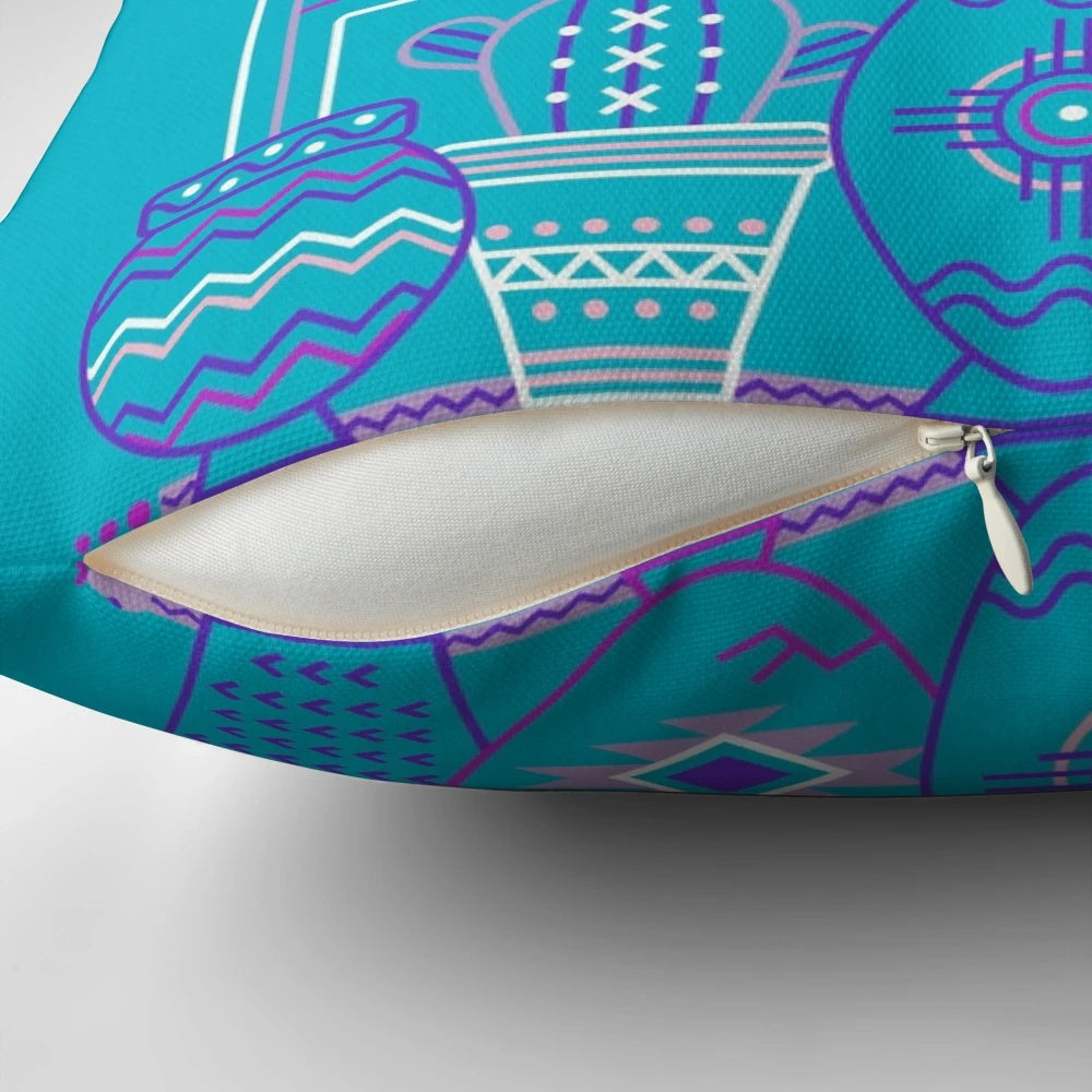 A vibrant blue and purple pillow featuring a southwestern-inspired cactus and succulent pattern, perfect for adding a touch of desert style to your home.