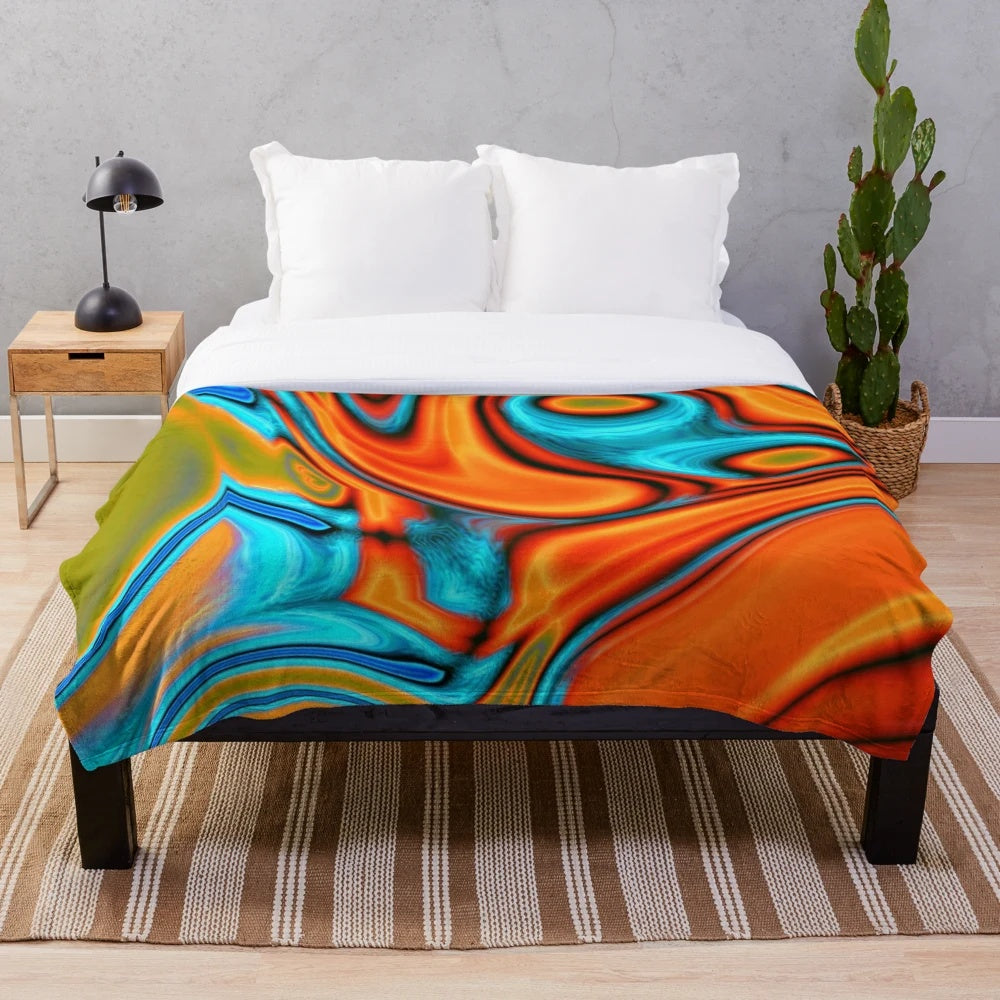 Plush blanket with vibrant turquoise and orange abstract swirl pattern