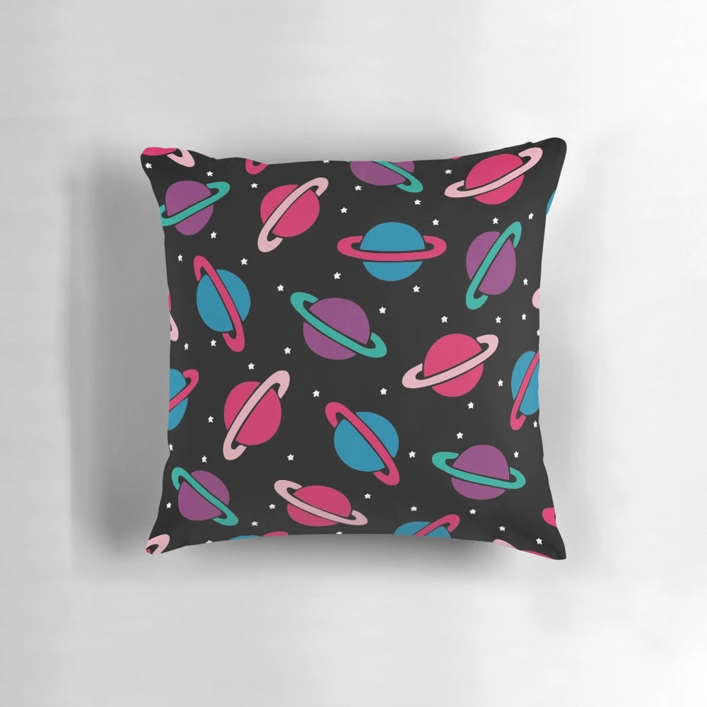 A colorful pillow featuring a neon space planets and constellation pattern, perfect for children's bedrooms and playrooms.