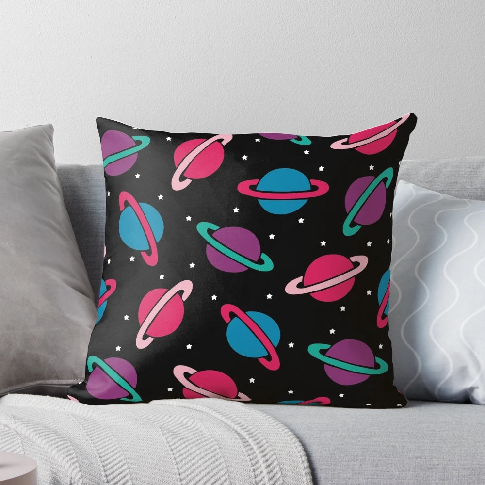 A colorful pillow featuring a neon space planets and constellation pattern, perfect for children's bedrooms and playrooms.