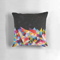 Colorful space-themed pillow with triangular, geometric patterns reminiscent of a nebula