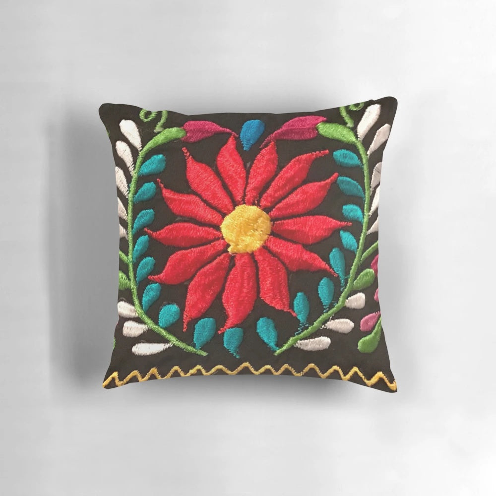 Colorful decorative pillow featuring a vibrant Spanish floral pattern