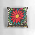 Colorful decorative pillow featuring a vibrant Spanish floral pattern
