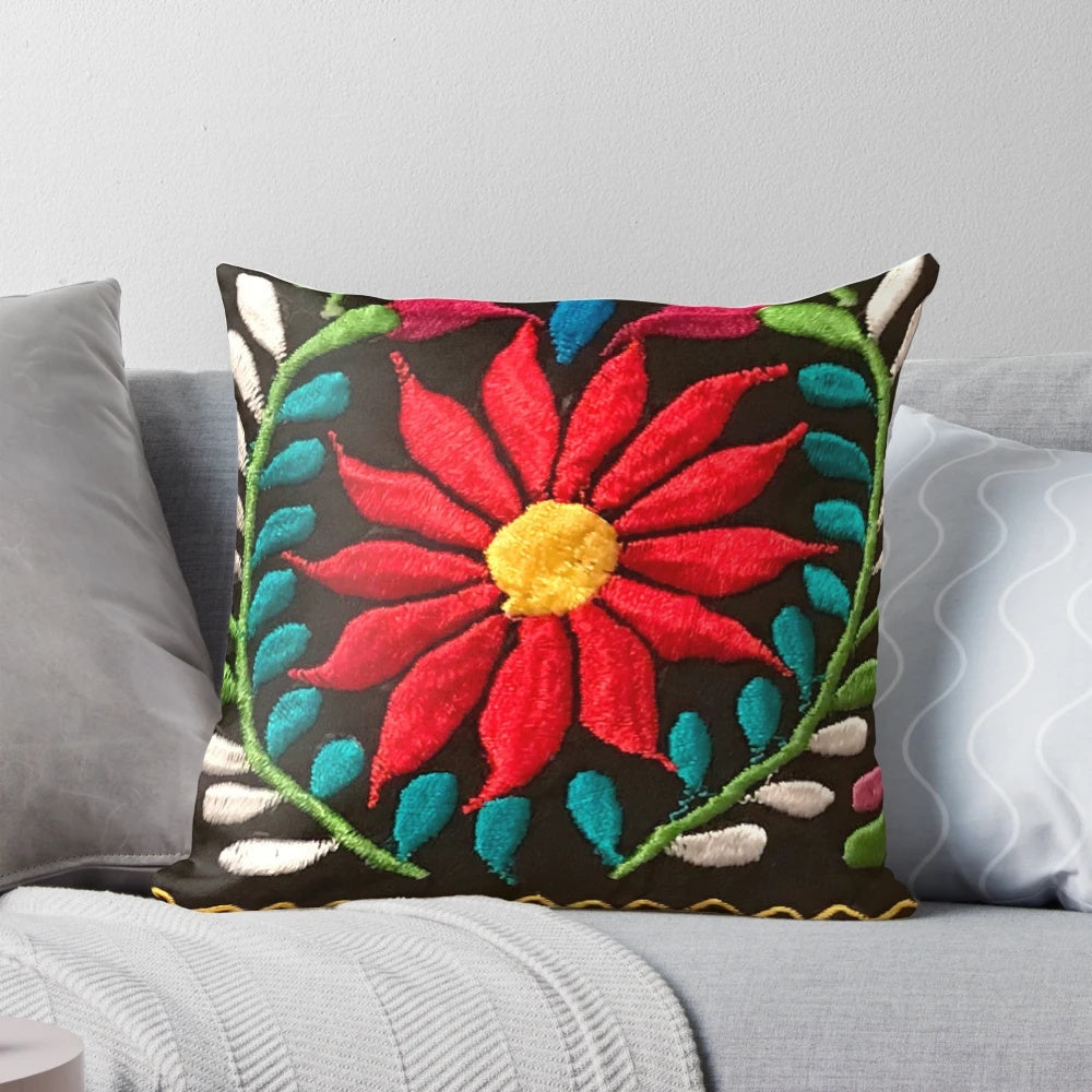 Colorful decorative pillow featuring a vibrant Spanish floral pattern