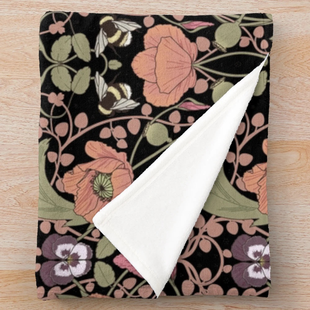 Plush blanket with a vibrant spring floral pattern featuring poppies and gladioli