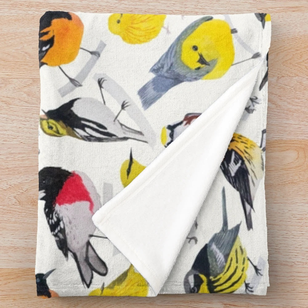 Colorful plush blanket featuring a vibrant watercolor design of birds and flowers